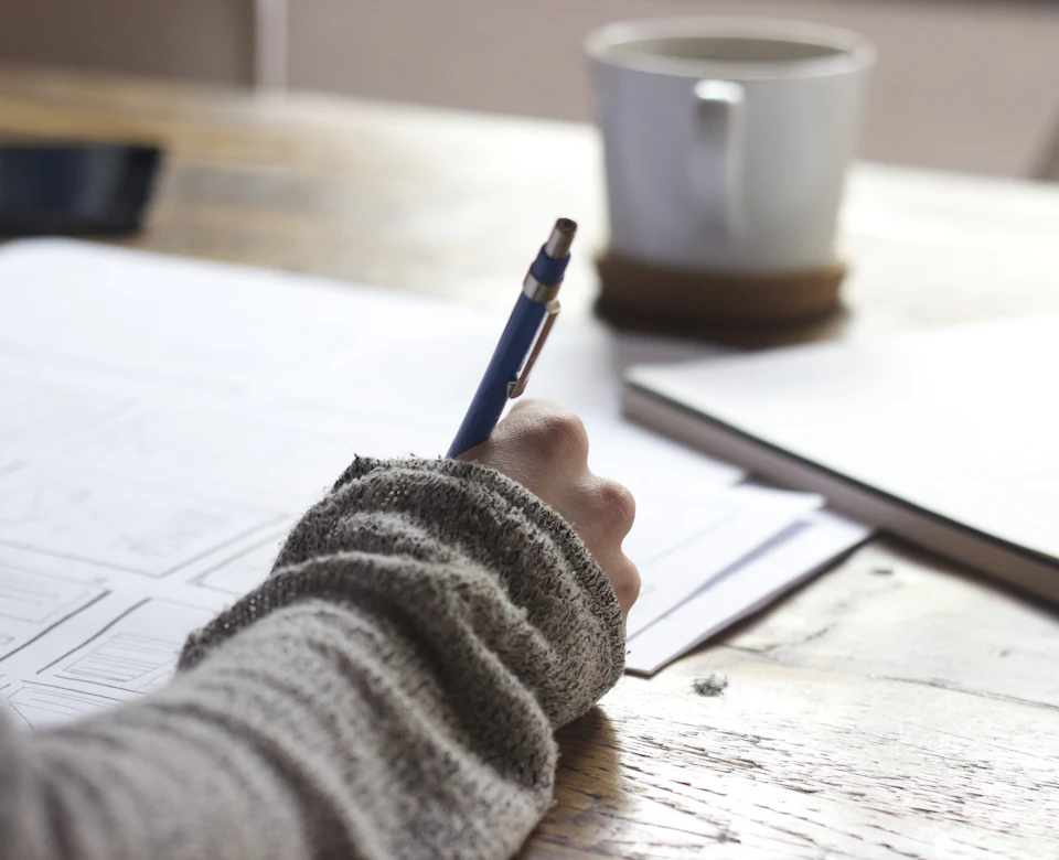 Student preparing for an exam with notes
