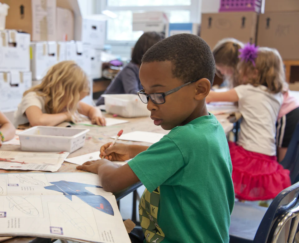 Young students learning together in a classroom